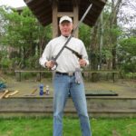 Jim Sobery with 
pistol & U.S. sword