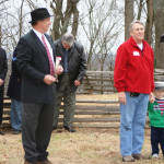 Philip Duer looks on as Fred Crown, with grandson, tells of his ancestor
