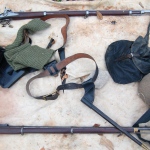 Reenactors' gear on ground cloth at Redoubt 1