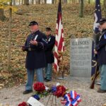 Stan Buckles addresses attendees during dedication